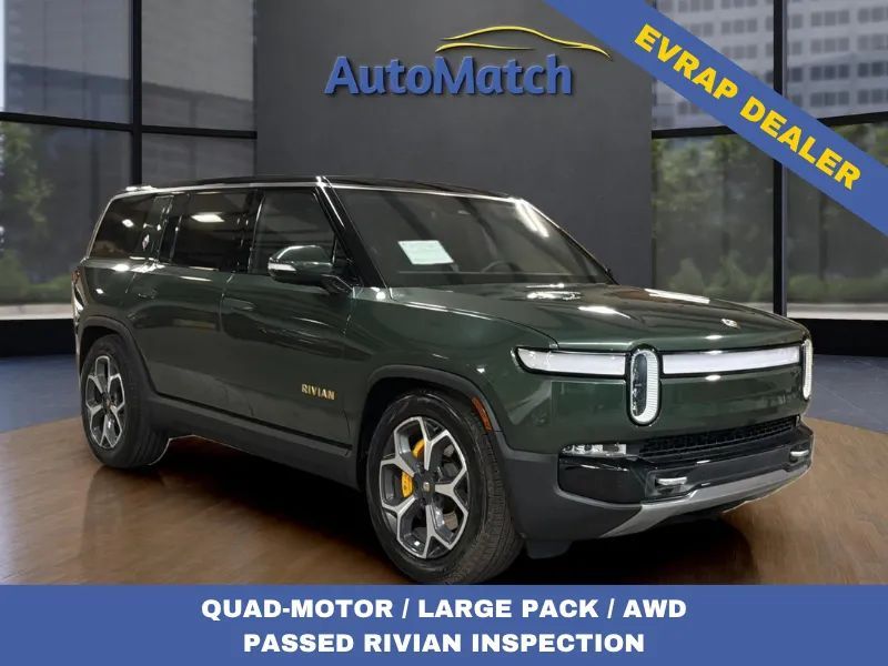 2023 Rivian R1S Adventure — rebuilt & branded title, 11% below market