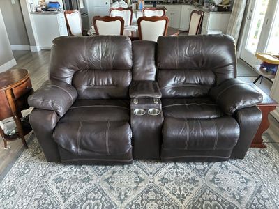 Brown Leather Reclining Loveseat with Console and Cupholders - Used