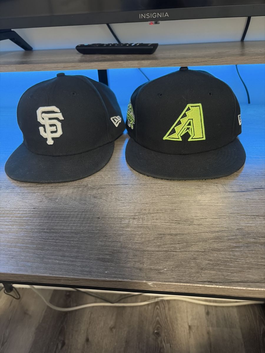 San Francisco Giants hat and Arizona Diamondbacks hat