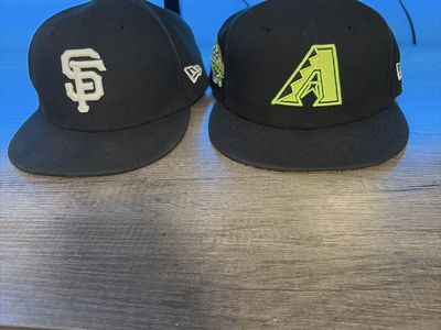 San Francisco Giants hat and Arizona Diamondbacks hat
