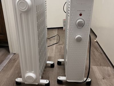 Set of 2 White Oil-Filled Radiator Space Heaters with Adjustable Thermostat and Wheels