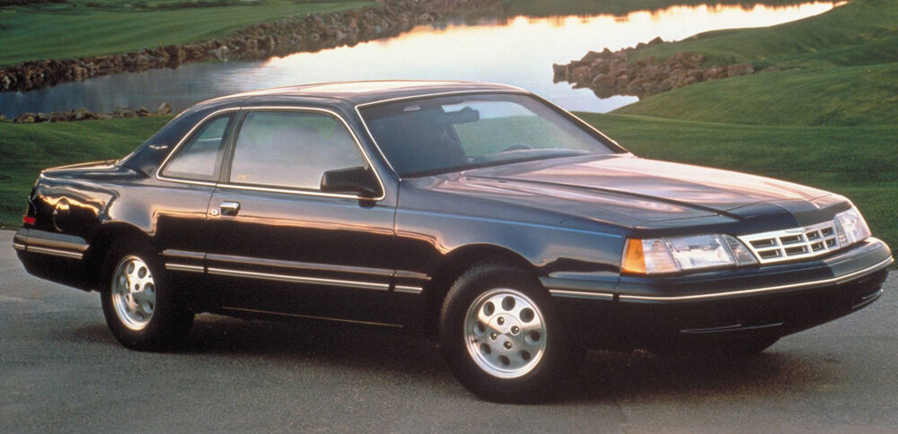 Set of FIVE FOUR BOLT FORD FACTORY ORIGINAL ALLOY RIMS. ALSO FITS MANY MORE MODERN FORD OR MERCURY COMPACT CARS