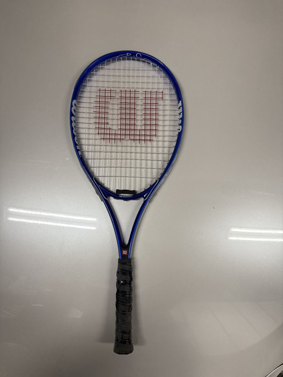Wilson Blue Tennis Racket with White and Red Stenciled Strings