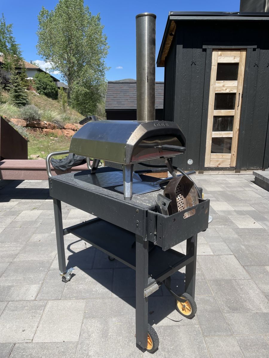 Ooni Karu 12 multi fuel pizza oven with cart and peels