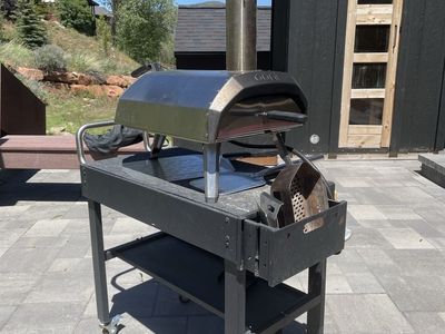 Ooni Karu 12 multi fuel pizza oven with cart and peels