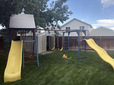 Lifetime Metal Backyard Playset with Clubhouse Roof, Swings, and Two Slides