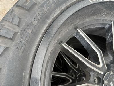 Fuel Ridge Grappler 35X12.50R22LT Tires with Black/Silver Wheels - Set of 4