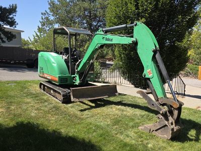 Bobcat 334, tons of extras, Auger Attachment, multiple buckets, mini excavator