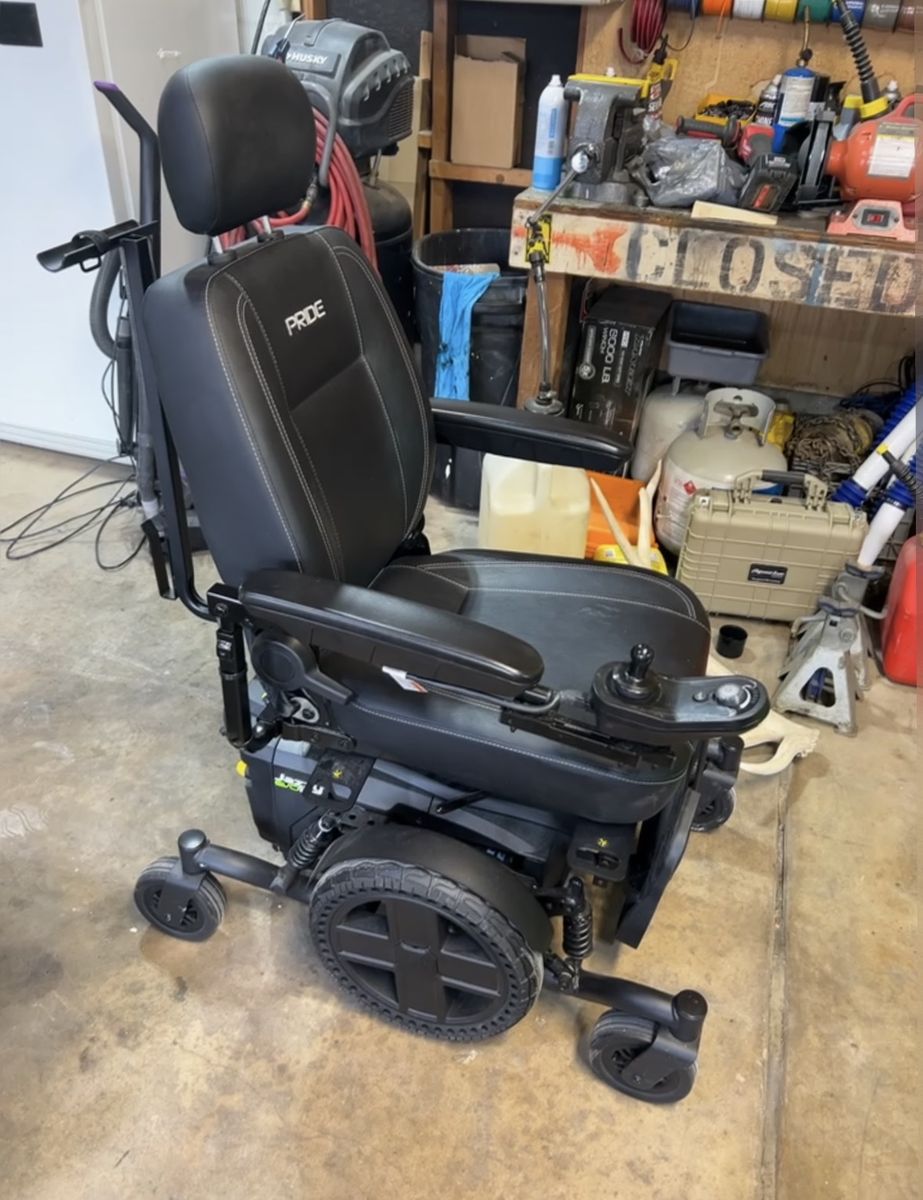 Like new  Power wheelchair in black with Joystick