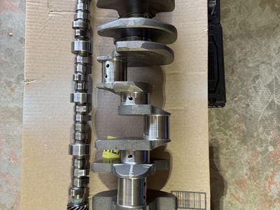 Chevy 305 heads, crank, cam, pistons, rods.