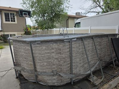 Used Coleman Power Steel 16' x 10' x 48" Oval Above Ground Swimming Pool Set w/ Ladder
