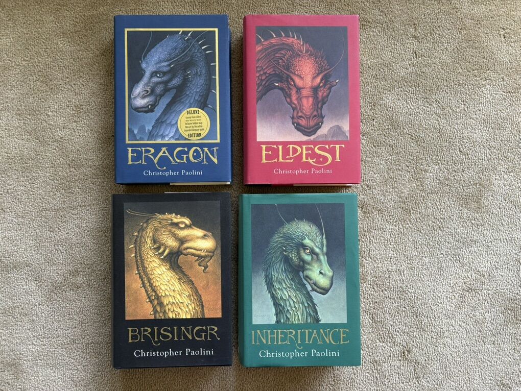 The Inheritance Cycle, by Christopher Paolini (hardcovers—one deluxe edition)