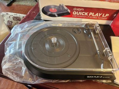 Ion Quick Play LP record player. Also has USB cable and software to record your albums.