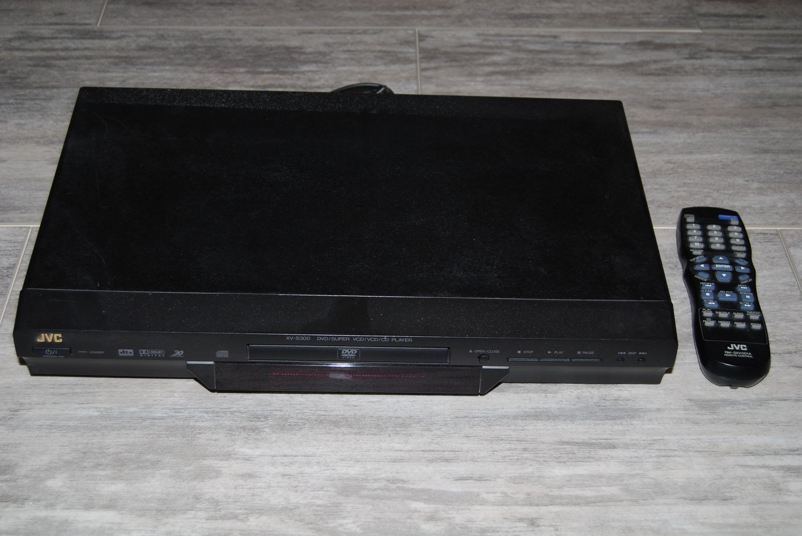 A JVC brand DVD player with remote.