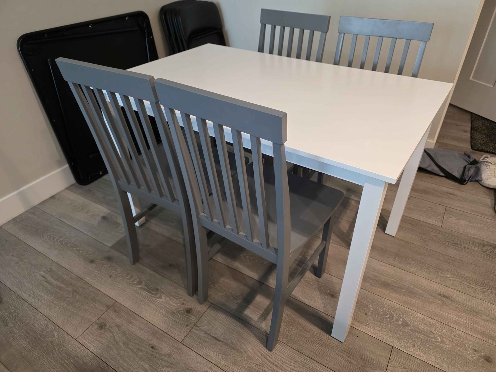 Modern White Dining Table with 4 Gray Chairs - Compact & Stylish