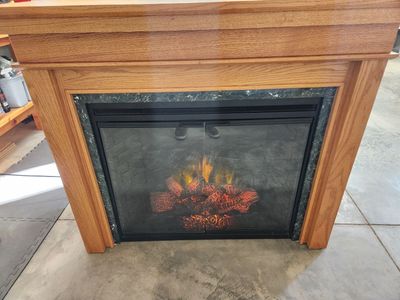 Electric Fireplace with Oak Mantel and Marble Trim