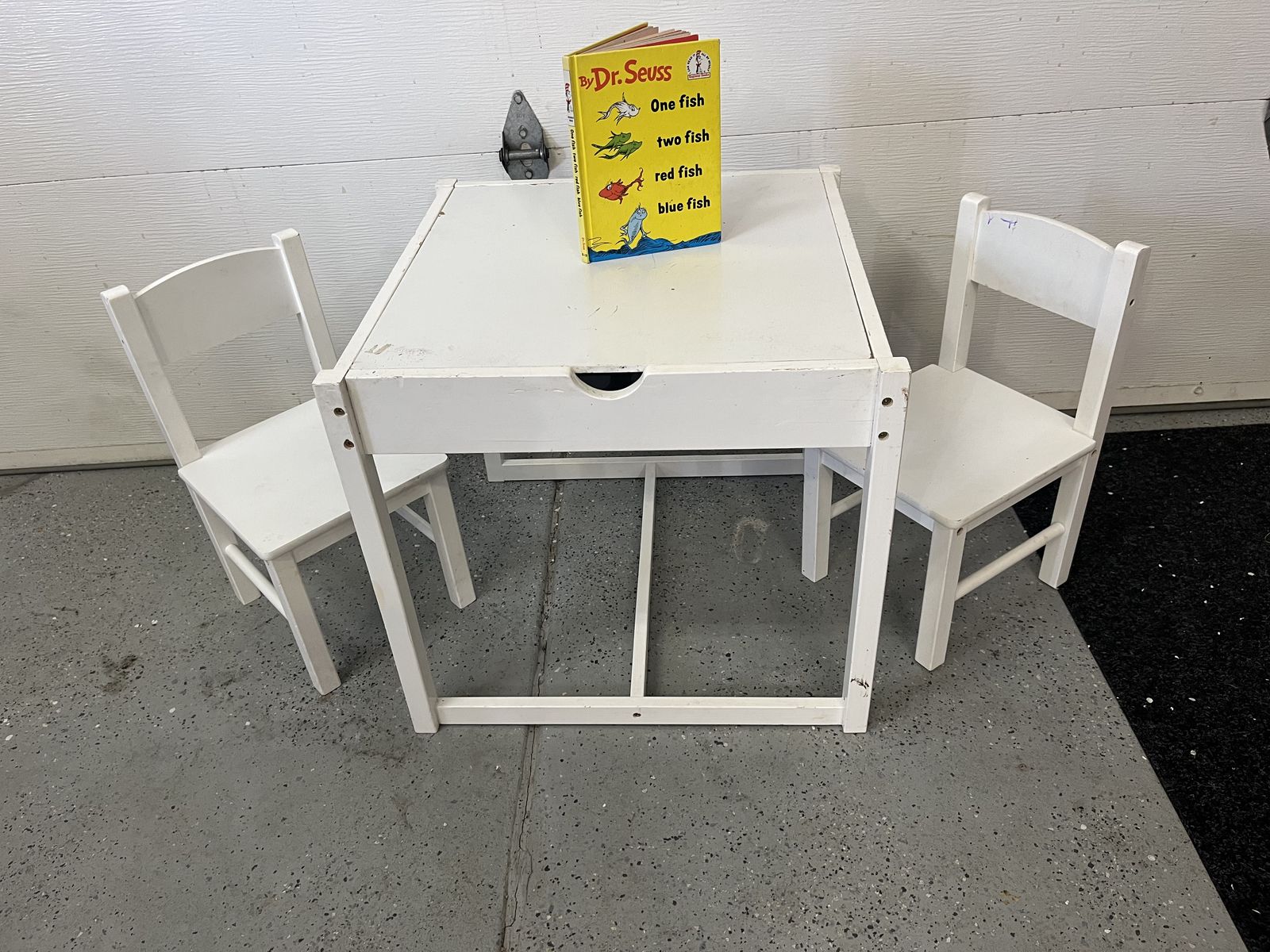 Kids table and chairs with storage inside.