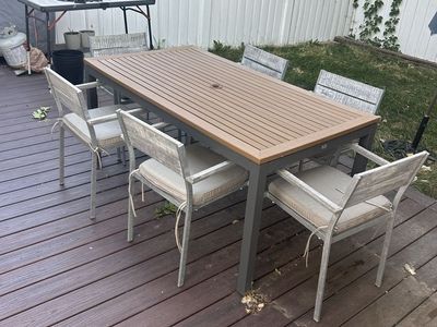Teak topped outdoor dining table and chairs