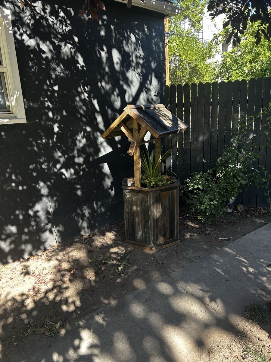 Homemade wooden wishing well