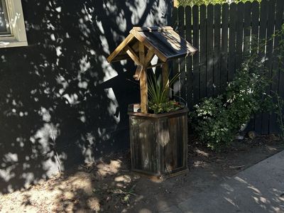 Homemade wooden wishing well