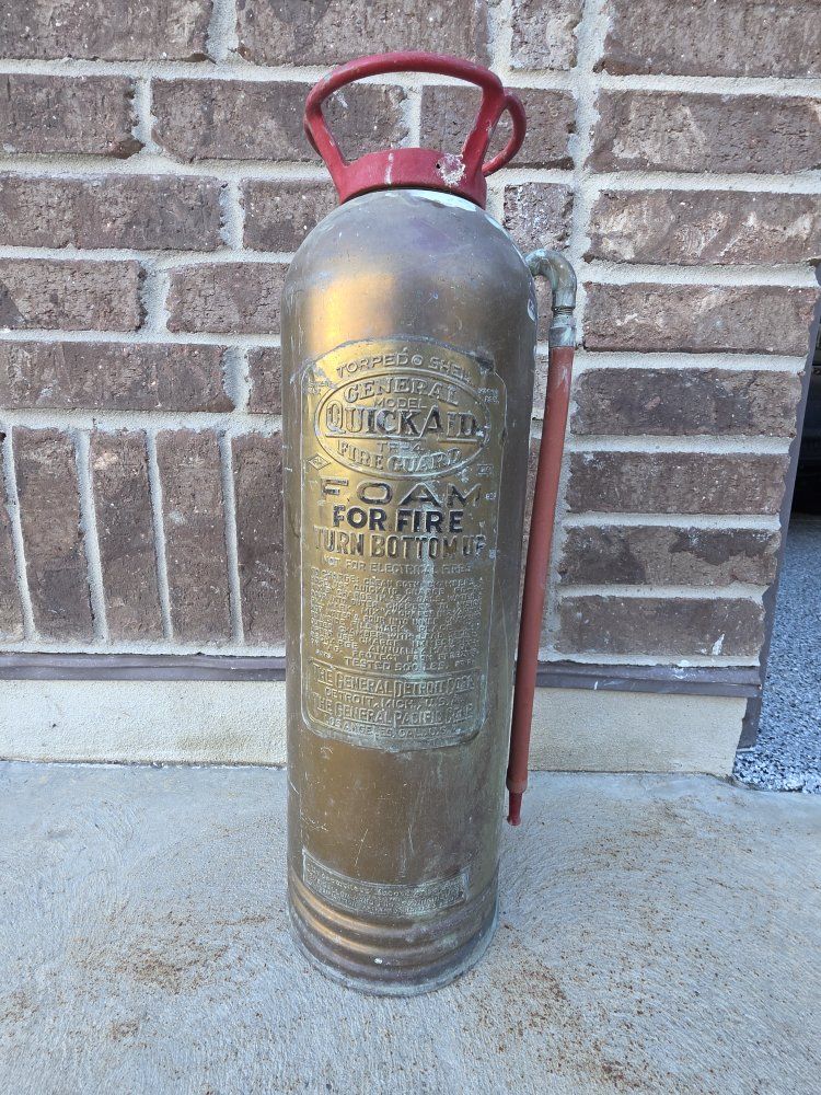 old brass fire extinguisher