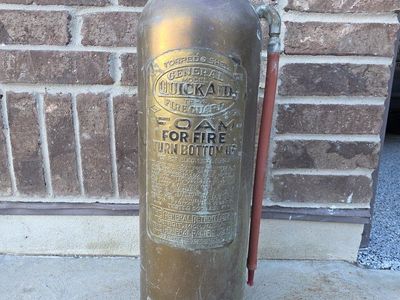 old brass fire extinguisher