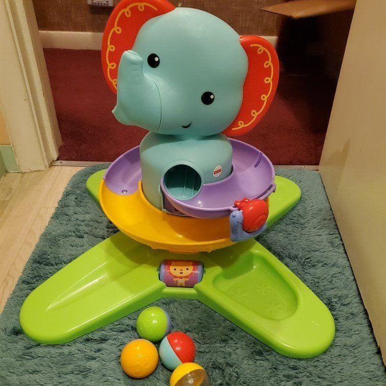 A discontinued Fisher-Price Silly Safari Swirlin' Surprise Elephant (Model DGT87).