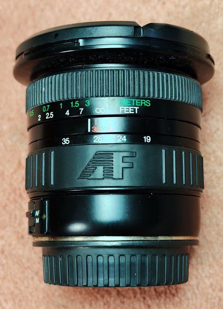 Promaster Spectrum 19-35mm lensLens is in excellent shape and functions 100%.  Solid upgrade from the standard 18-55mm Canon kit