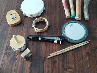 Remo Practice Pad with Drumsticks and Assorted Percussion Instruments