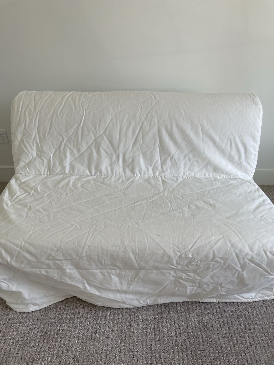 Gray futon with white cover