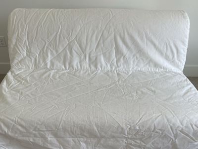 Gray futon with white cover
