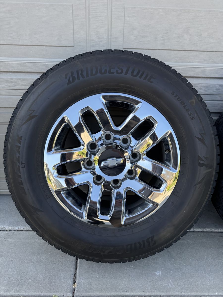 Set of 4 Chevy Chrome Wheels with Bridgestone Blizzak LT Tires LT275/65R18