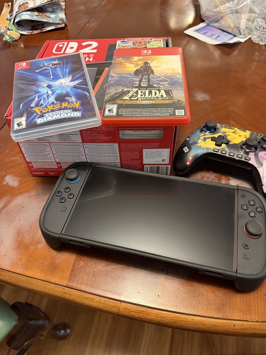Nintendo Switch Console with Dbrand Case, Games, and Controller