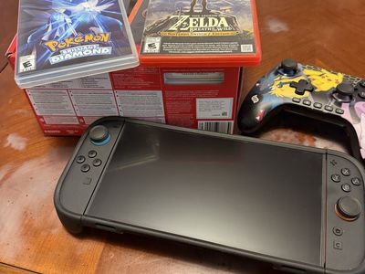 Nintendo Switch Console with Dbrand Case, Games, and Controller