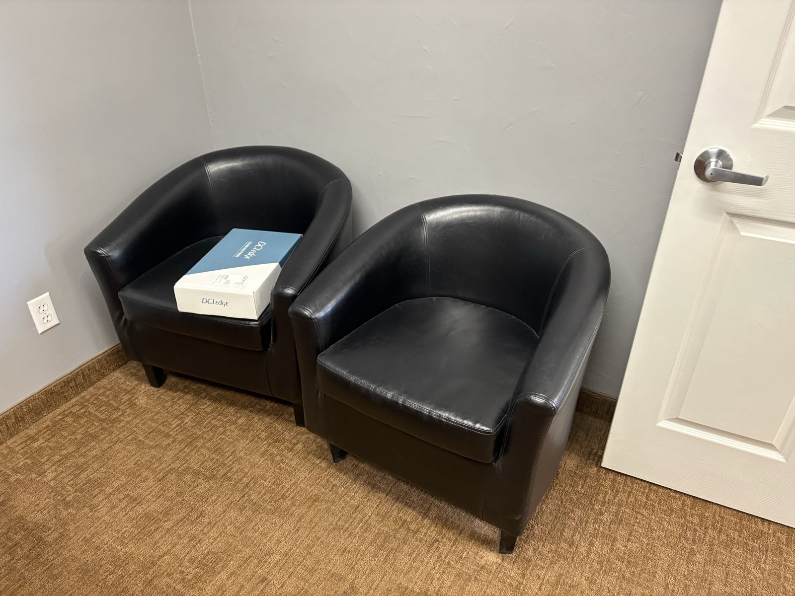 Pair of Black Faux Leather Barrel Accent Chairs