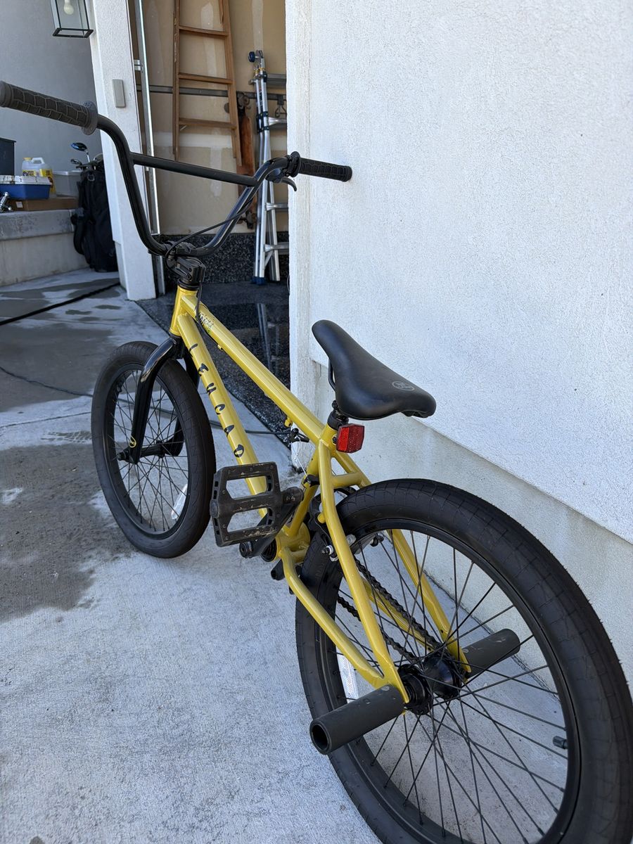 Acadia Yellow BMX Bike with Black Handlebars and Pegs