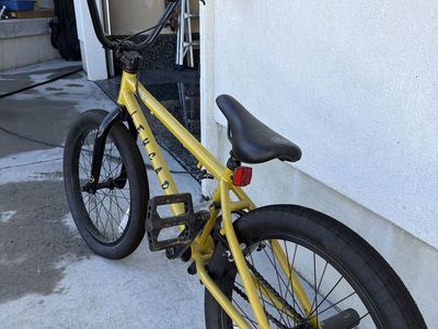 Acadia Yellow BMX Bike with Black Handlebars and Pegs