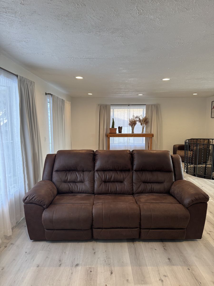 Dark Brown Reclining Sofa with Drop Down Table
