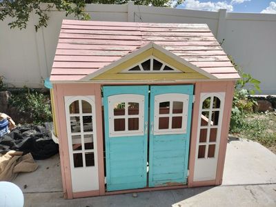 Colorful Wooden Outdoor Playhouse for Kids - Pink Roof, Blue Doors, Yellow Trim FREE (pending pick up)