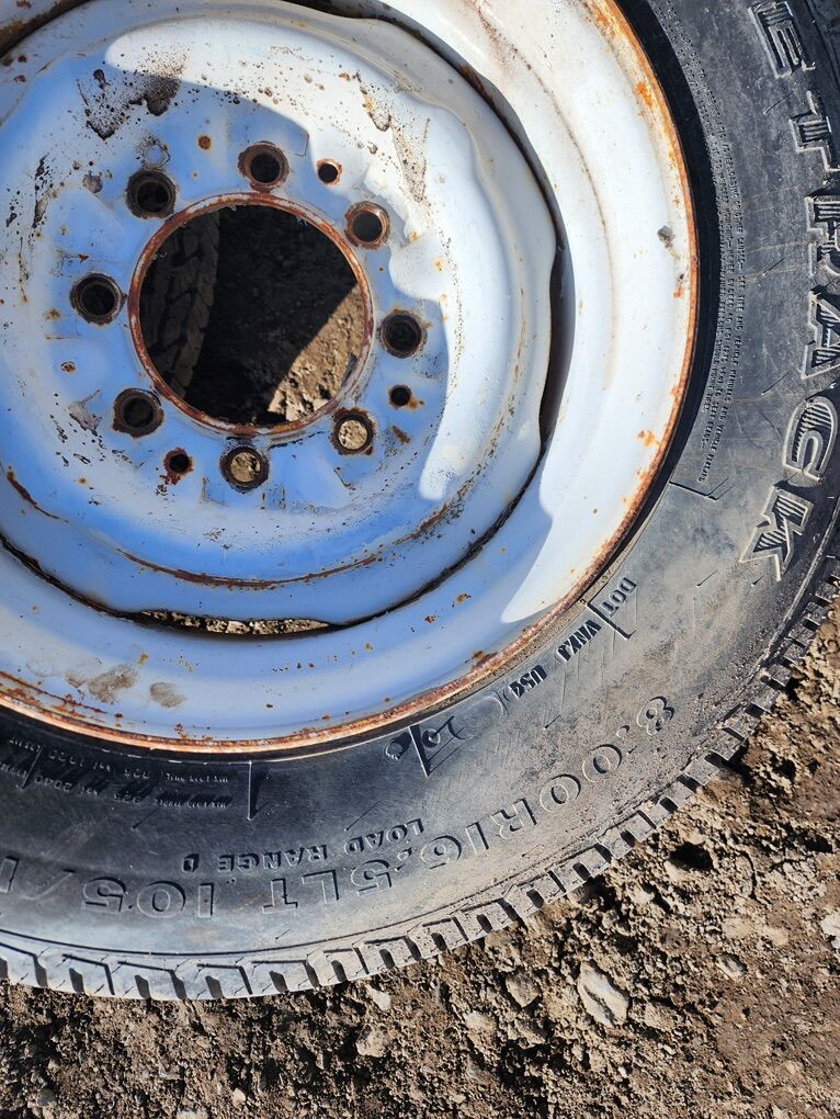 Four 8.00R16.5 tires and rims