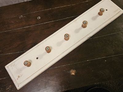 wood spool hanger for jackets, hats, and aprons