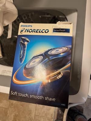 Philips Norelco electric shaver, never used. Open box only.