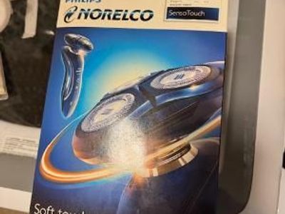 Philips Norelco electric shaver, never used. Open box only.