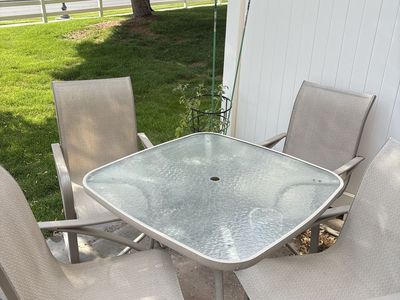 Outdoor Patio Dining Set: Square Glass Table & 4 Beige Sling Chairs with Covers