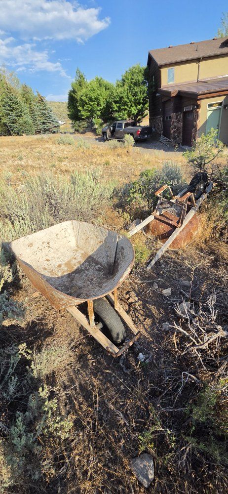 Vintage Metal Wheelbarrow Pair with Wooden Handles - Rust & Weathered Finish