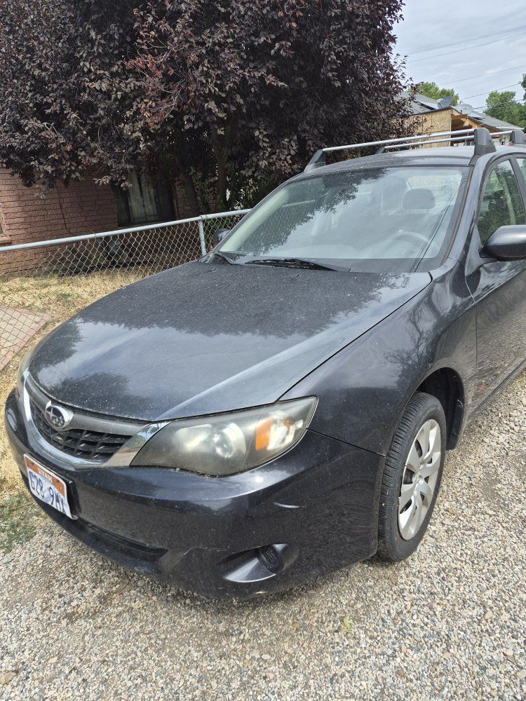 Gray Subaru impreza for parts