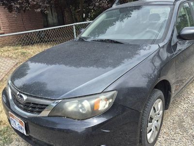 Gray Subaru impreza for parts