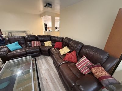 Large Brown Leather Sectional Sofa with Reclining Features