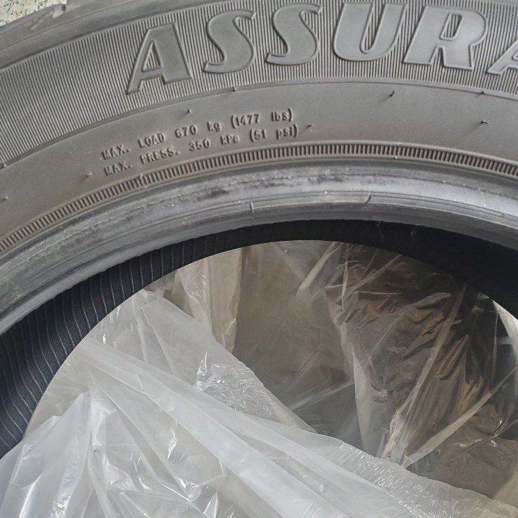Two Goodyear Assurance Maxlife 215/55R17 94V all-season high mileage touring tires.