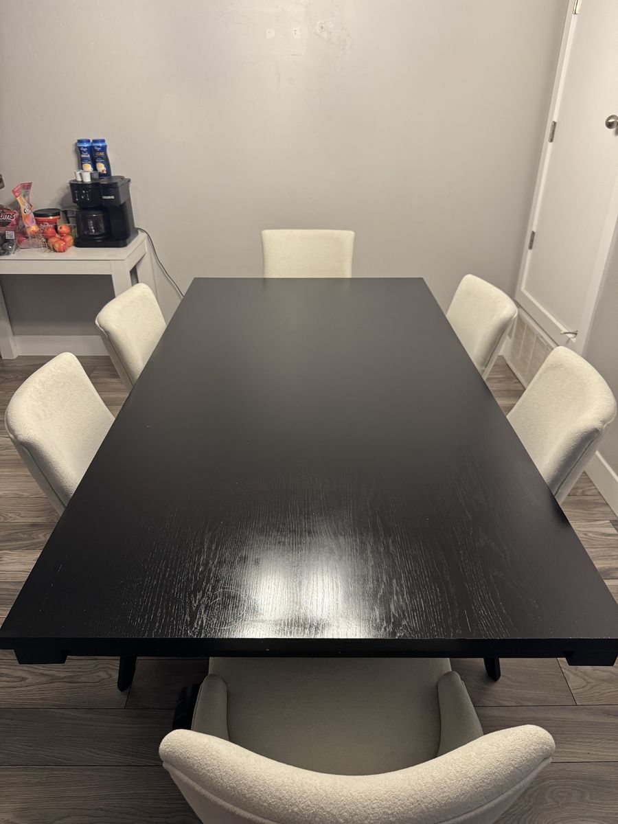 Black Dining Table with Cream Upholstered Chairs